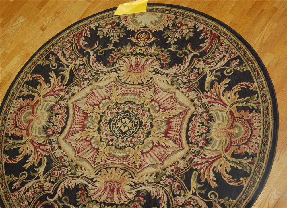 Appraisal: SHAW INDUSTRIES AUBUSSON ROUND RUG having an architectural design in