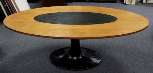 Appraisal: An oval dining table in the manner of Eero Saarinen