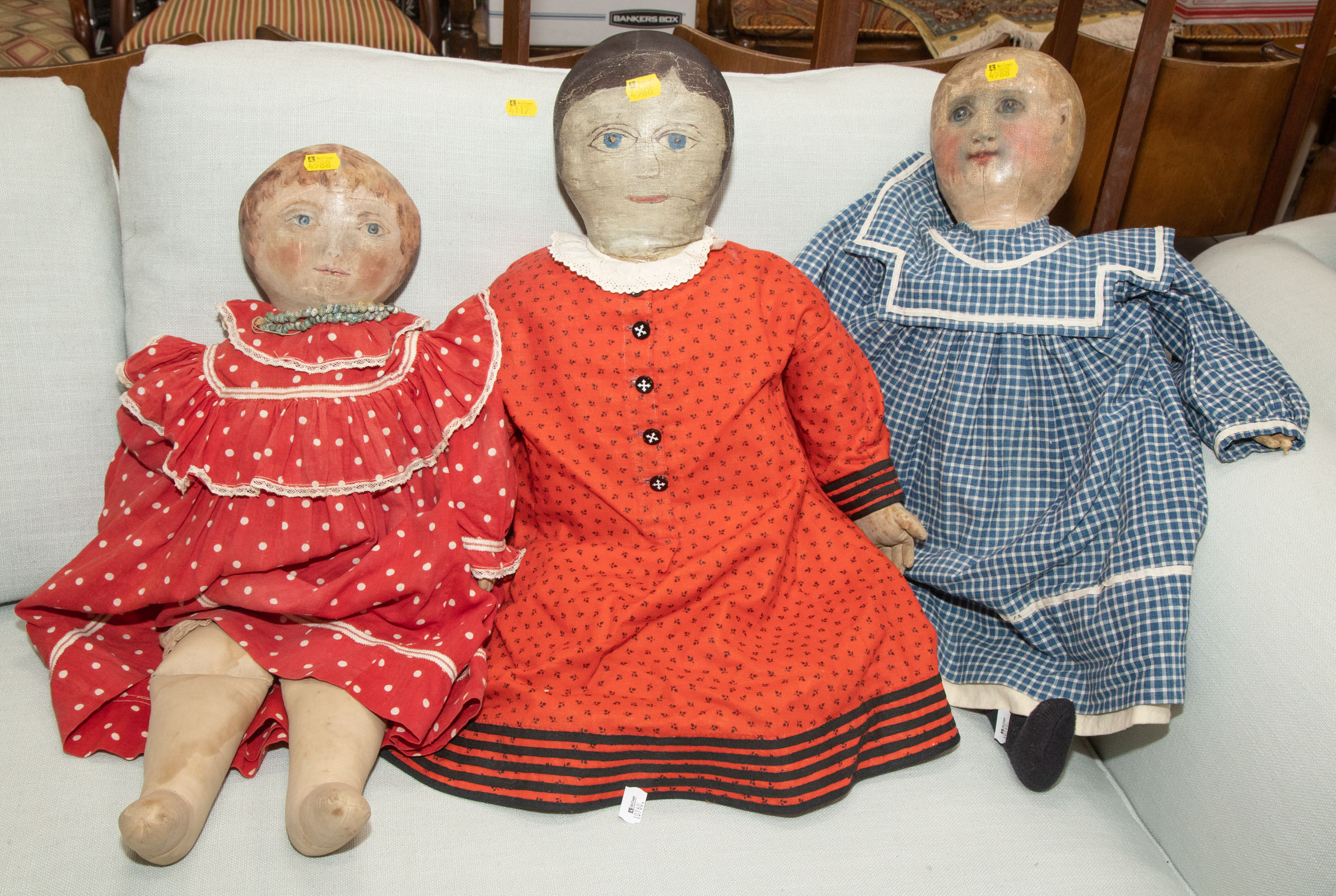 Appraisal: THREE PAINTED CANVAS DOLLS American th century with hand-painted faces