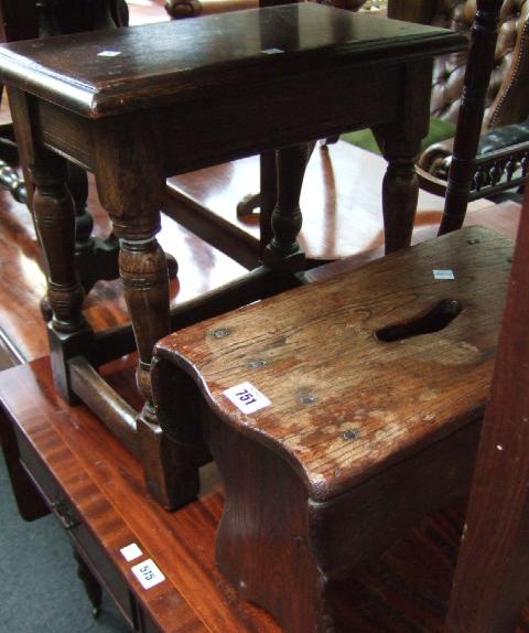 Appraisal: An elm trestle stool and an oak joint stool