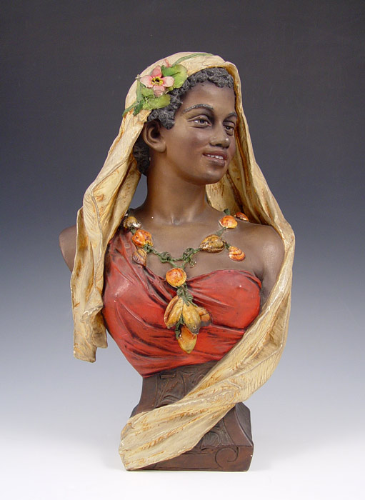 Appraisal: ORIENTALIST BLACKAMOOR CERAMIC BUST Nicely detailed from the flower in