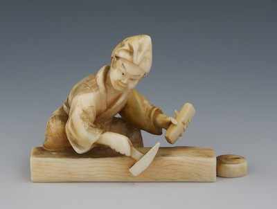 Appraisal: A Carved Ivory Miniature of a Carpenter Meiji Taisho Period