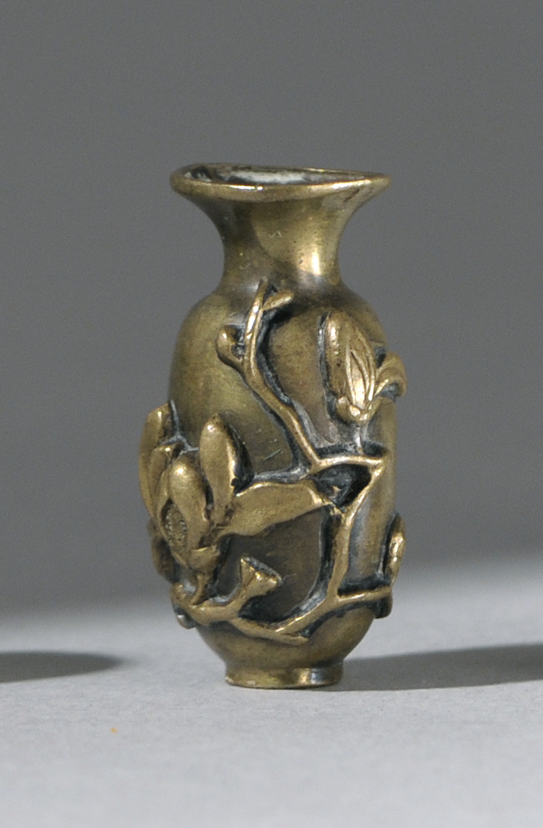 Appraisal: RELIEF-DECORATED BRASS OJIME th CenturyIn vase form with flower and