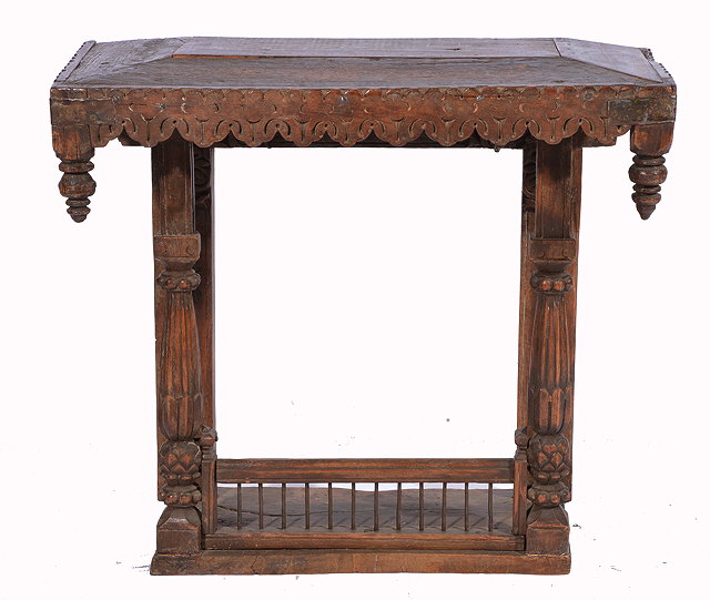 Appraisal: A GUJARATI CARVED HARDWOOD HOUSEHOLD SHRINE with carved shaped pediment