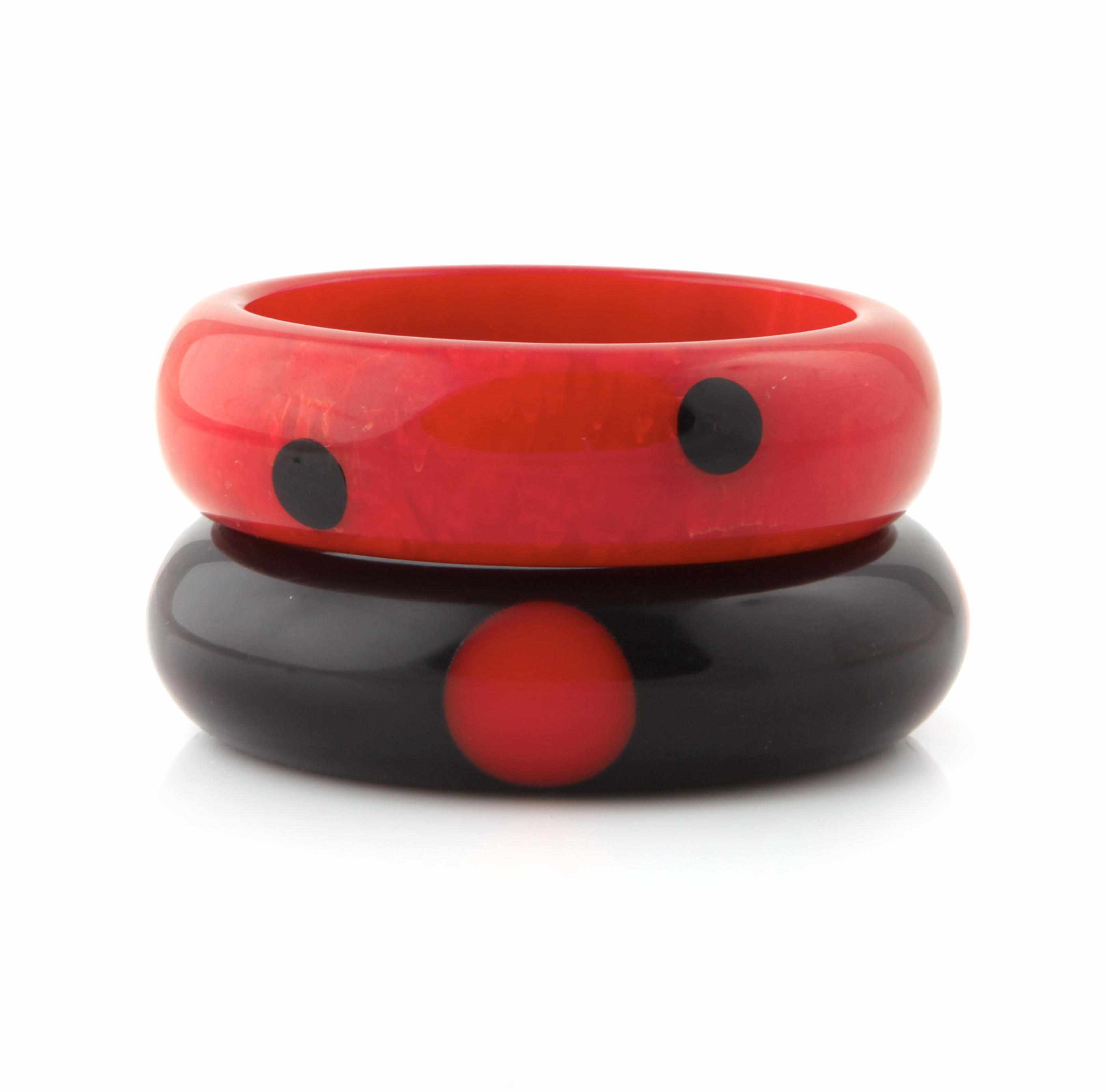 Appraisal: Two red and black Bakelite ''dot'' bangle bracelets each diameter