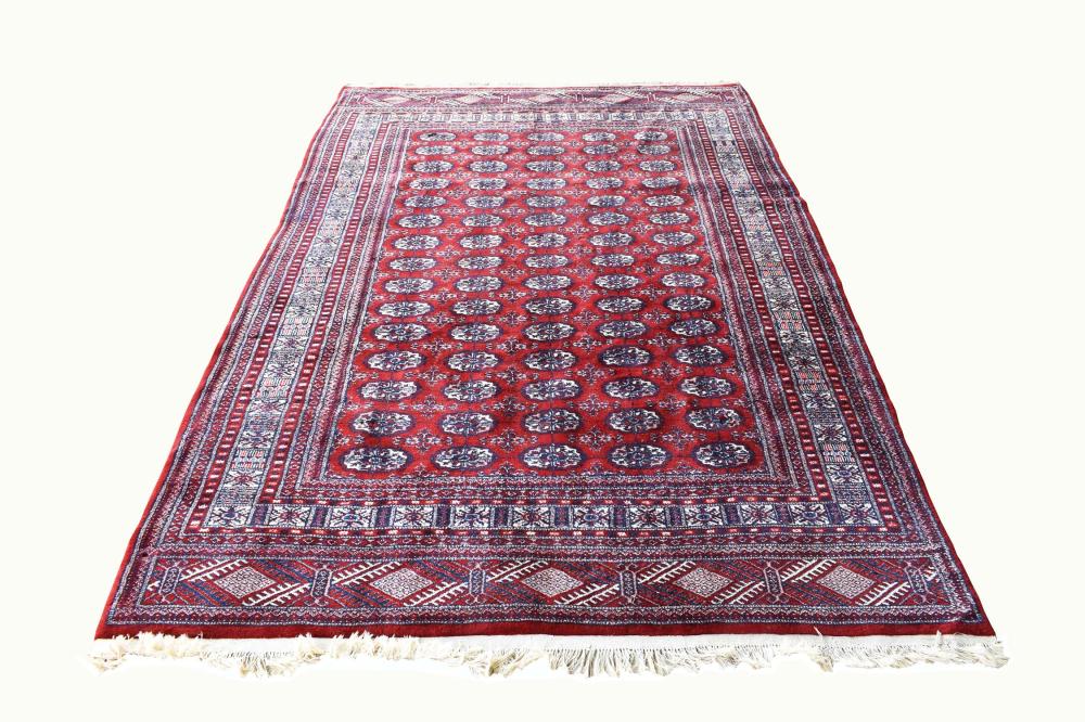 Appraisal: TEKKE BOKHARA CARPETWith white rosettes on a red ground with