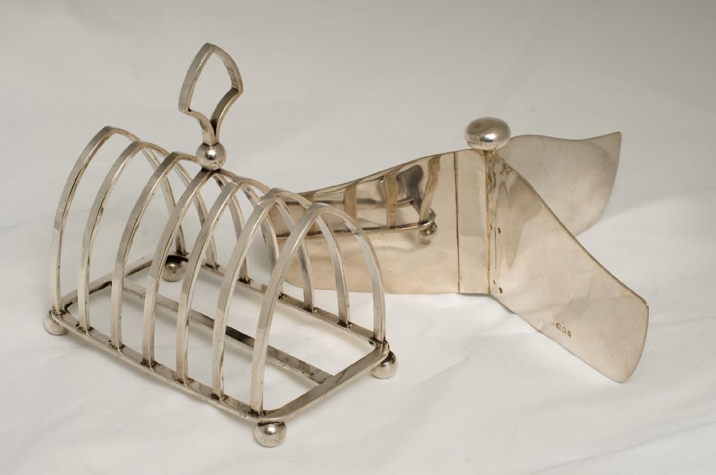 Appraisal: WMF SILVER-PLATED SEVEN-BAR TOAST RACK c raised on four bun