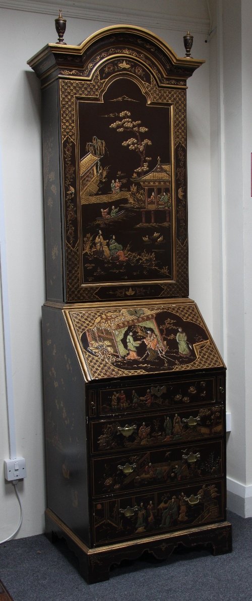 Appraisal: A narrow bureau bookcase lacquered with Oriental scenes the arched