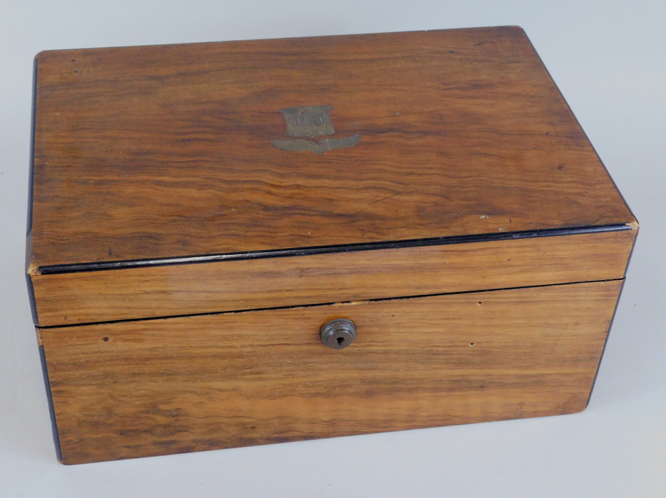 Appraisal: A Victorian walnut and ebonised writing box the hinged lid