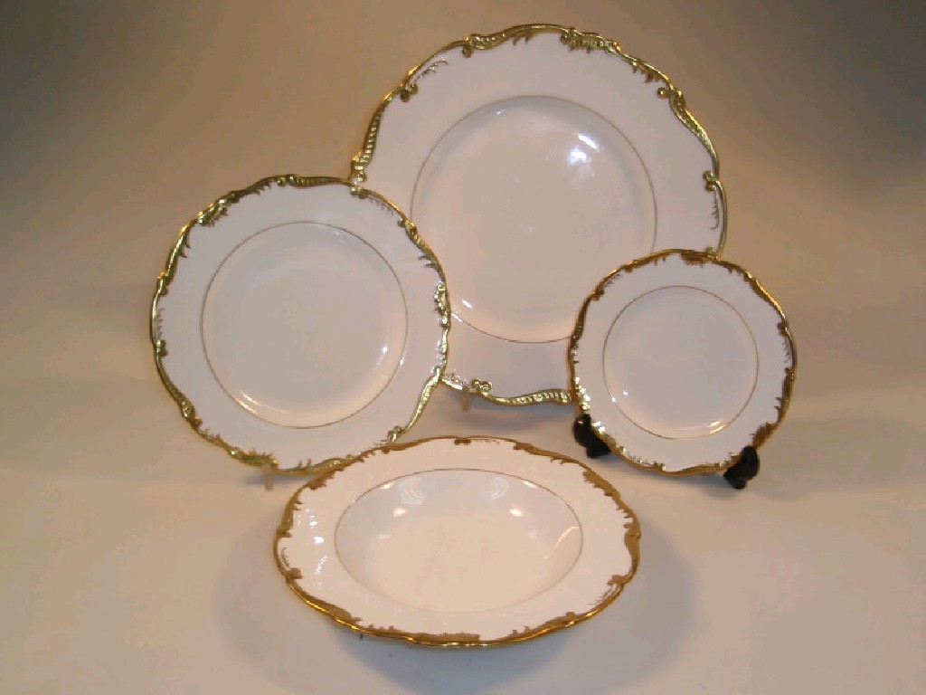 Appraisal: A Coalport 'Admiral' part dinner service with a gilt foliate