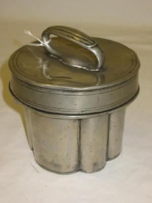 Appraisal: A PEWTER JELLY ICECREAM MOULD of circular form the lid