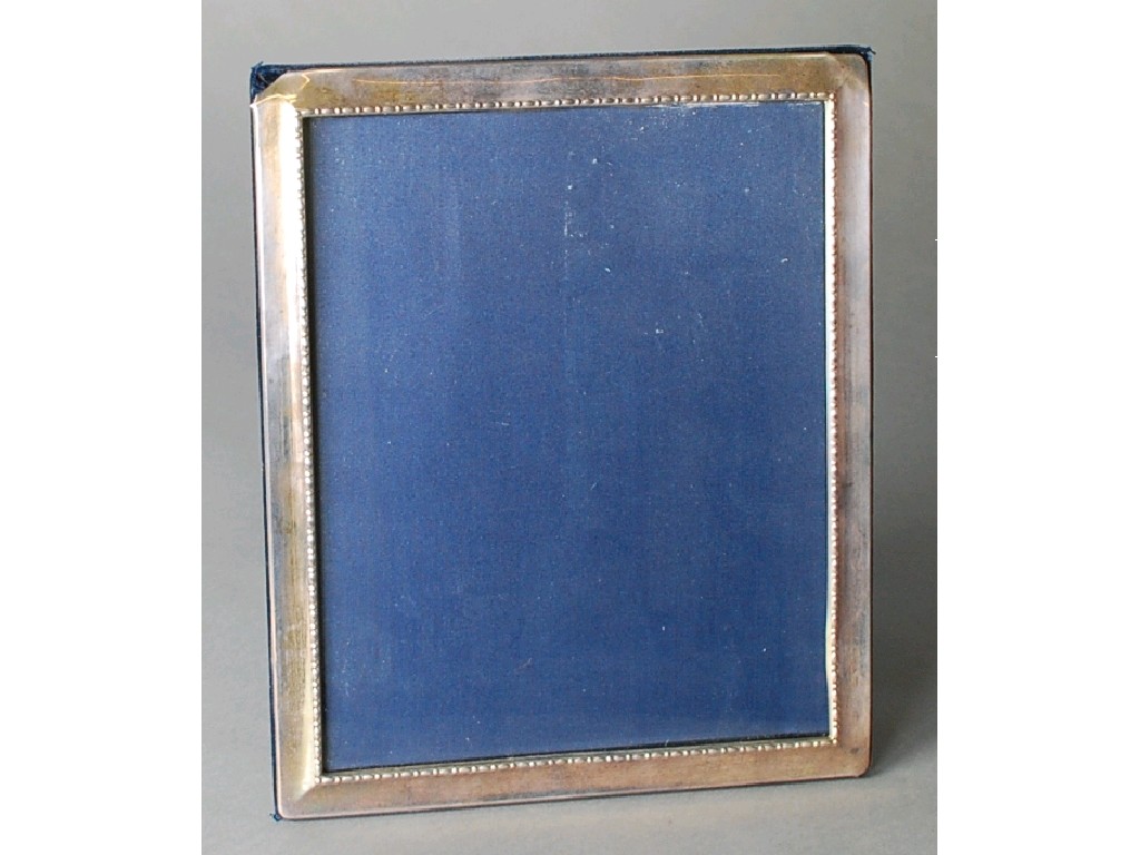 Appraisal: SILVER EASEL PHOTOGRAPH FRAME cavetto and bead and bar embossed