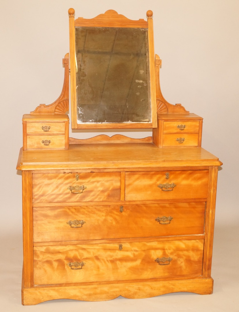 Appraisal: An Edwardian satin birch dressing chest the raised back with