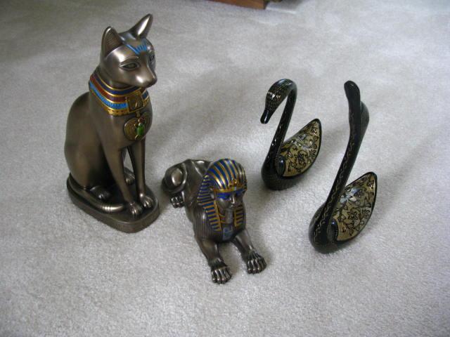 Appraisal: Four Cast Metal Figurines including a cat in a sphinx