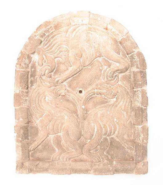 Appraisal: A carved stone wall plaque depicting three mythical beasts height