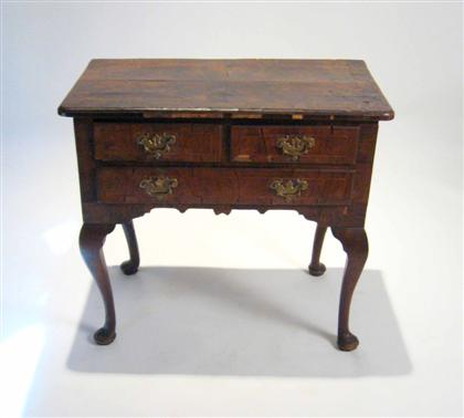 Appraisal: George II walnut and crossbanded dressing table circa The crossbanded