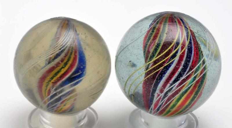 Appraisal: Lot of Divided Core Swirl Marbles Description The smaller marble