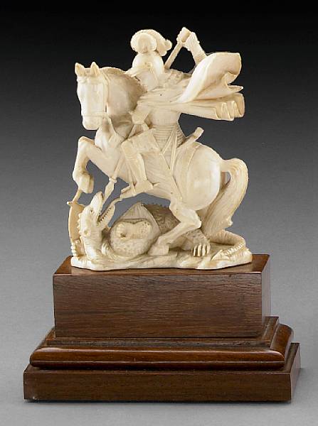 Appraisal: A Continental carved ivory figural group th century Depicting St