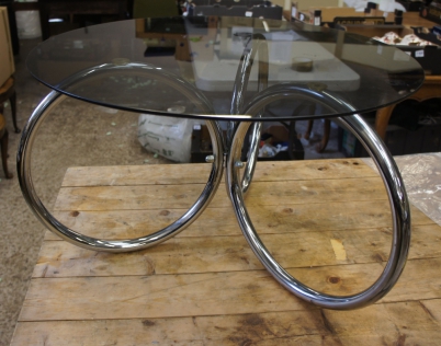 Appraisal: A stainless steel glass top coffee table