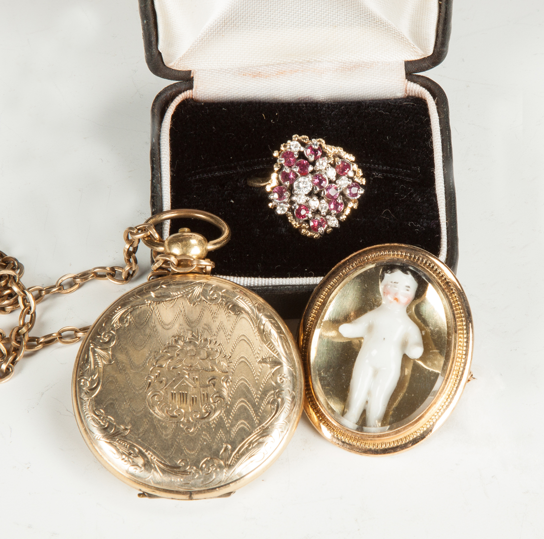 Appraisal: Three Pieces of Vintage Jewelry K gold locket with daguerreotypes