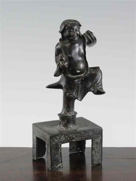 Appraisal: A Chinese bronze dancing figure of a man holding a