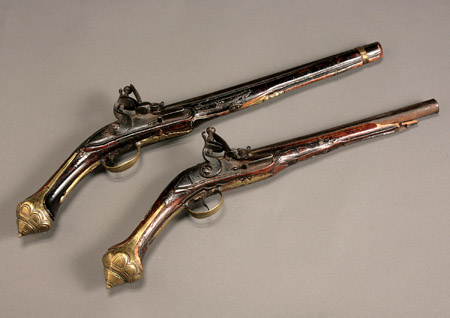 Appraisal: Two Ottoman Brass Mounted and Silver Inlaid Flintlock Pistols Turkey