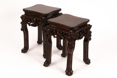 Appraisal: A pair of Chinese hardwood stands the tops with beaded