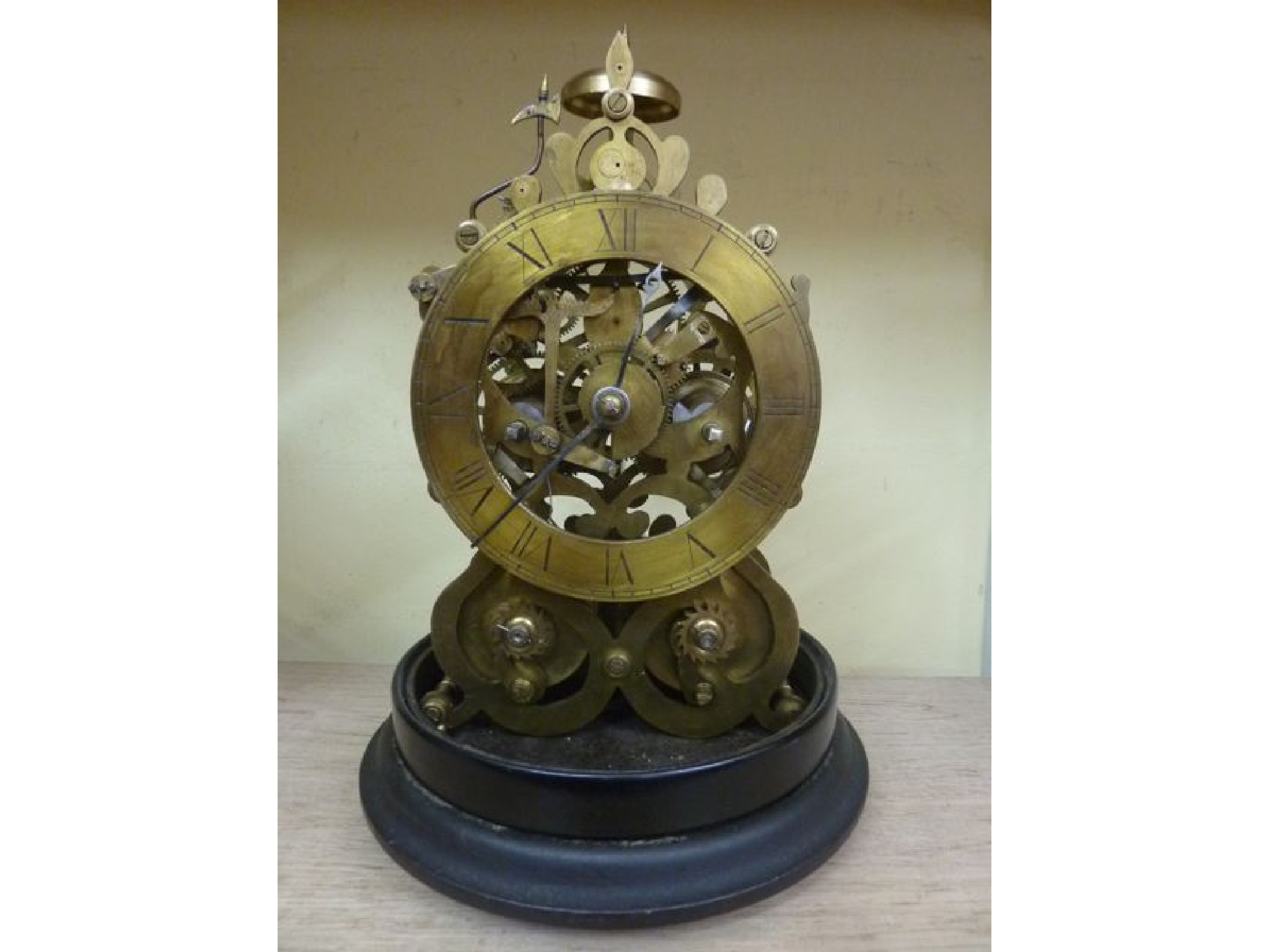 Appraisal: A skeleton clock with two train movement brass dial and