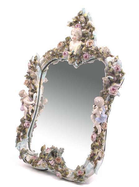 Appraisal: A German porcelain floral encrusted mirror height in width in