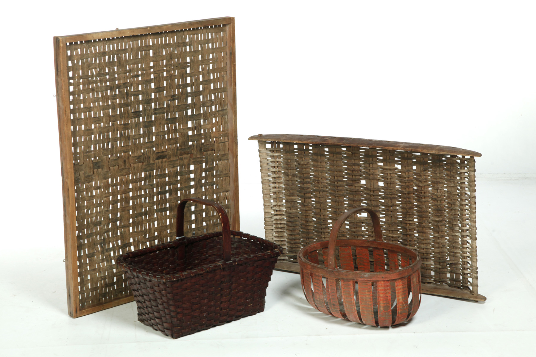 Appraisal: TWO AMERICAN BASKETS AND TWO RACKS Nineteenth century Woven splint