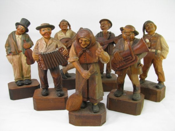 Appraisal: Seven German hand carved and painted wood figures of a