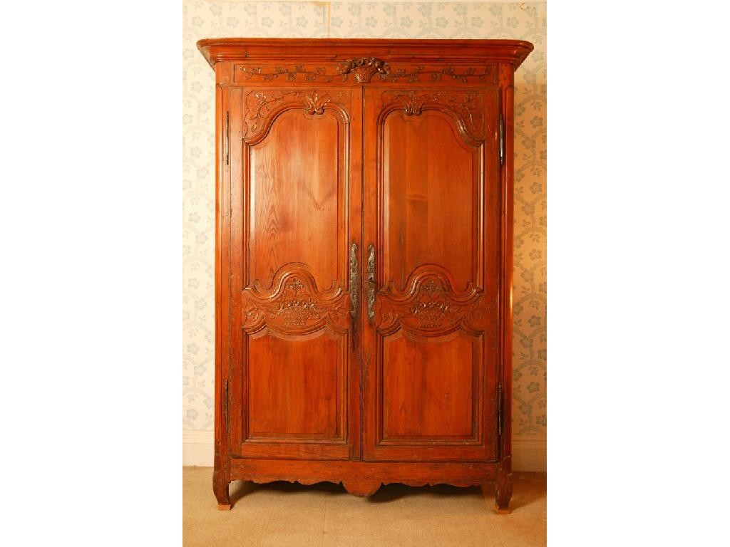 Appraisal: A FRENCH PINE ARMOIRE with a moulded frieze over a