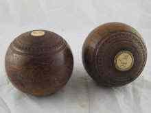 Appraisal: A pair of Lignum Vitae bowls with ivory insets