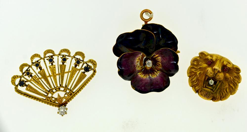 Appraisal: Three Gold Pins Three gold pins one k enamel pansy