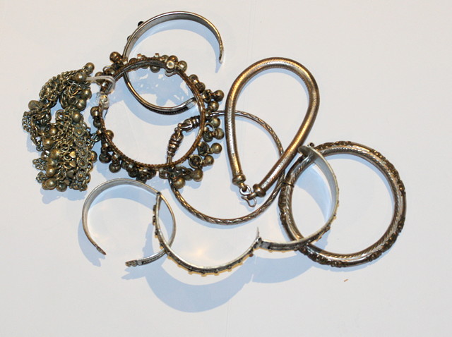 Appraisal: A COLLECTION OF SIX MIDDLE EASTERN BRACELETS and two anklets