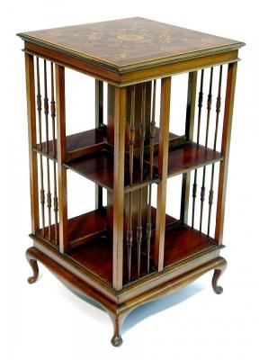 Appraisal: AN EDWARDIAN MAHOGANY REVOLVING BOOKCASE of square form crossbanded with