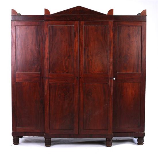 Appraisal: REGENCY BREAKFRONTED WARDROBE early th century possibly English Pediment crown