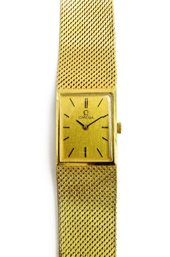 Appraisal: An Omega ct gold rectangular cased bracelet wristwatch the signed