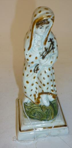 Appraisal: A PRATTWARE MALE FIGURE late th century modelled as Winter