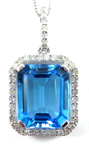 Appraisal: BLUE TOPAZ AND DIAMOND PENDANT NECKLACE The pendant is suspended