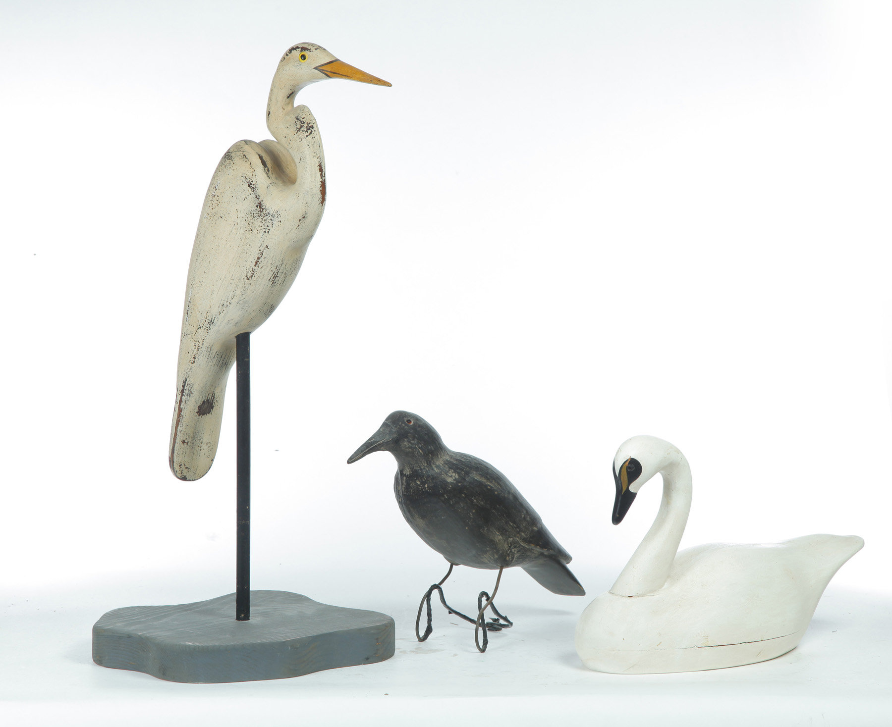 Appraisal: THREE AMERICAN BIRD CARVINGS Twentieth century Crow decoy l heron