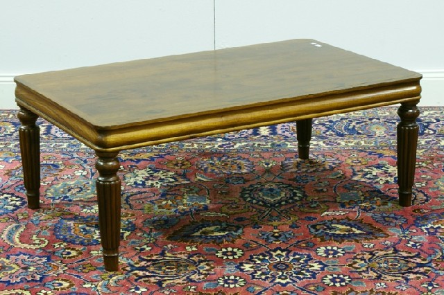 Appraisal: A rectangular coffee table with reeded legs cm wide cm