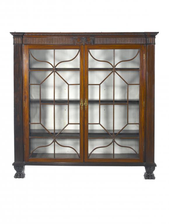 Appraisal: A MAHOGANY BREAKFRONT CABINET with rosette cornice and fluted frieze