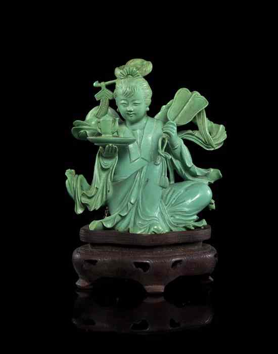 Appraisal: A Chinese Turquoise Figural Carving depicting a woman in a