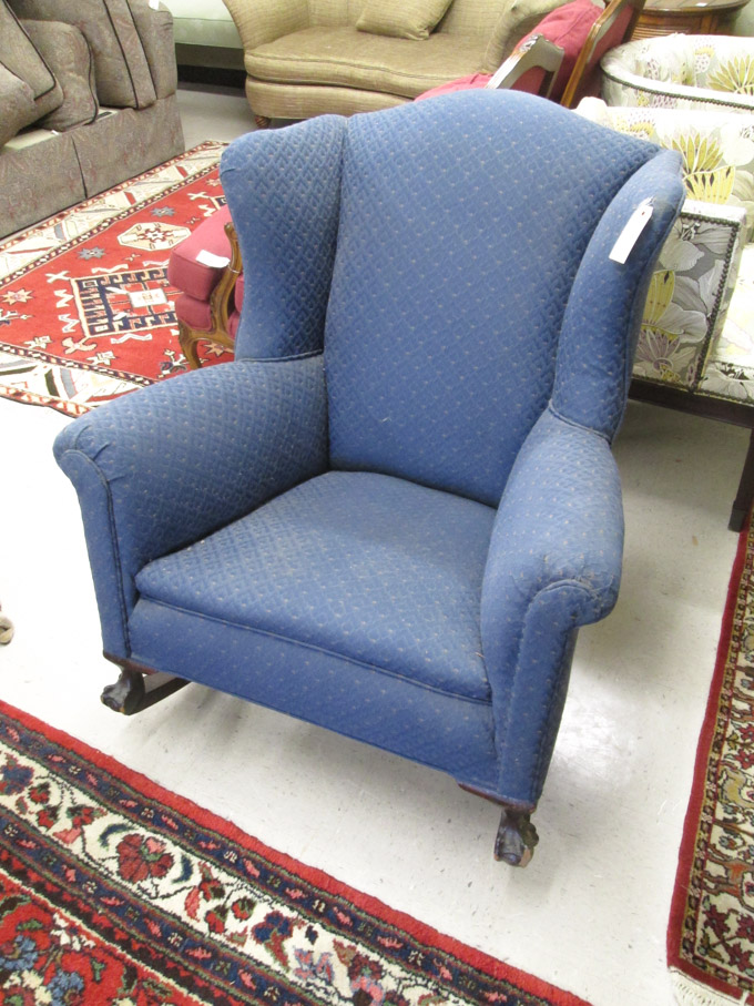 Appraisal: CHIPPENDALE STYLE WINGBACK ROCKING CHAIR American c with later blue