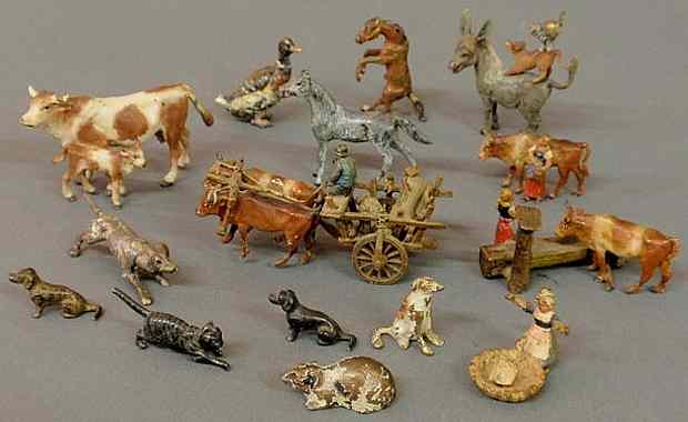 Appraisal: Fifteen small Vienna cold painted animals etc cow h cart