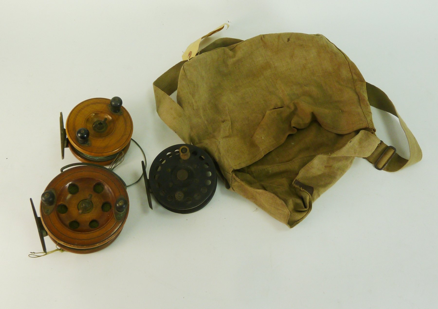 Appraisal: Two wooden star back fishing reels and a bakelite star