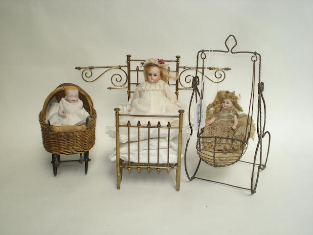 Appraisal: Miniature Kestner bisque head doll in metal bed With fixed