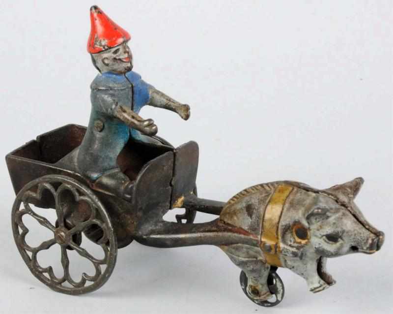 Appraisal: Cast Iron Pig-Drawn Clown Cart Toy American Probably made by