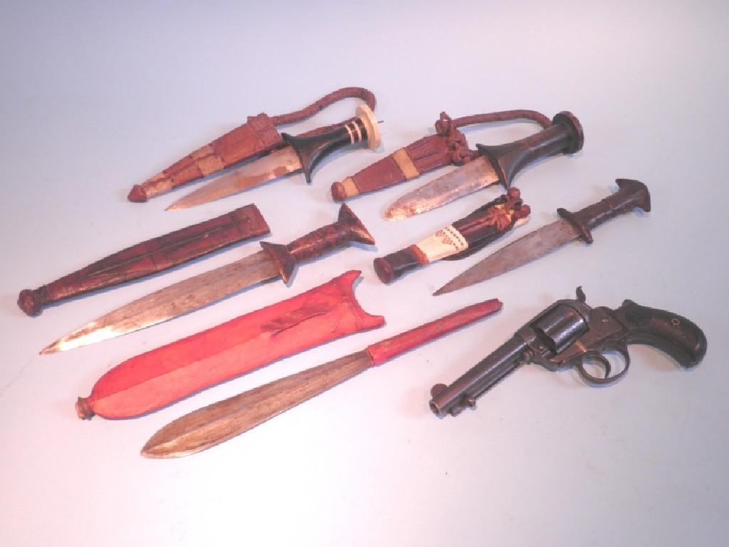 Appraisal: Five mini African daggers each in a leather sheath